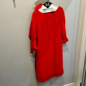 Elegant red dress. Hits knees on 5’7”.